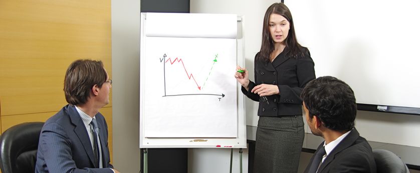 Three people in a business meeting.