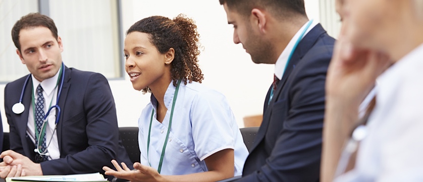 health psychologist presenting to group of doctors