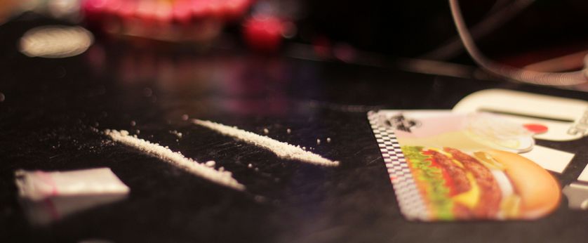 Two lines of cocaine on a table.