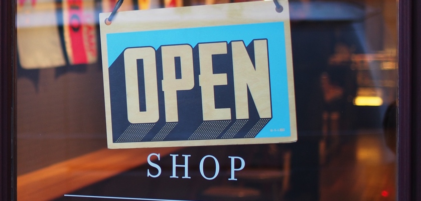 an open sign in a shop window