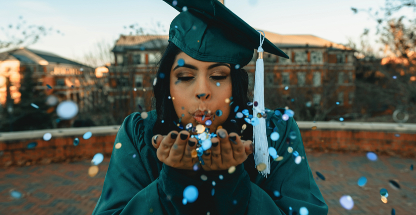 graduate celebrating with confetti