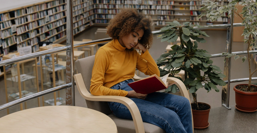 woman studying in library